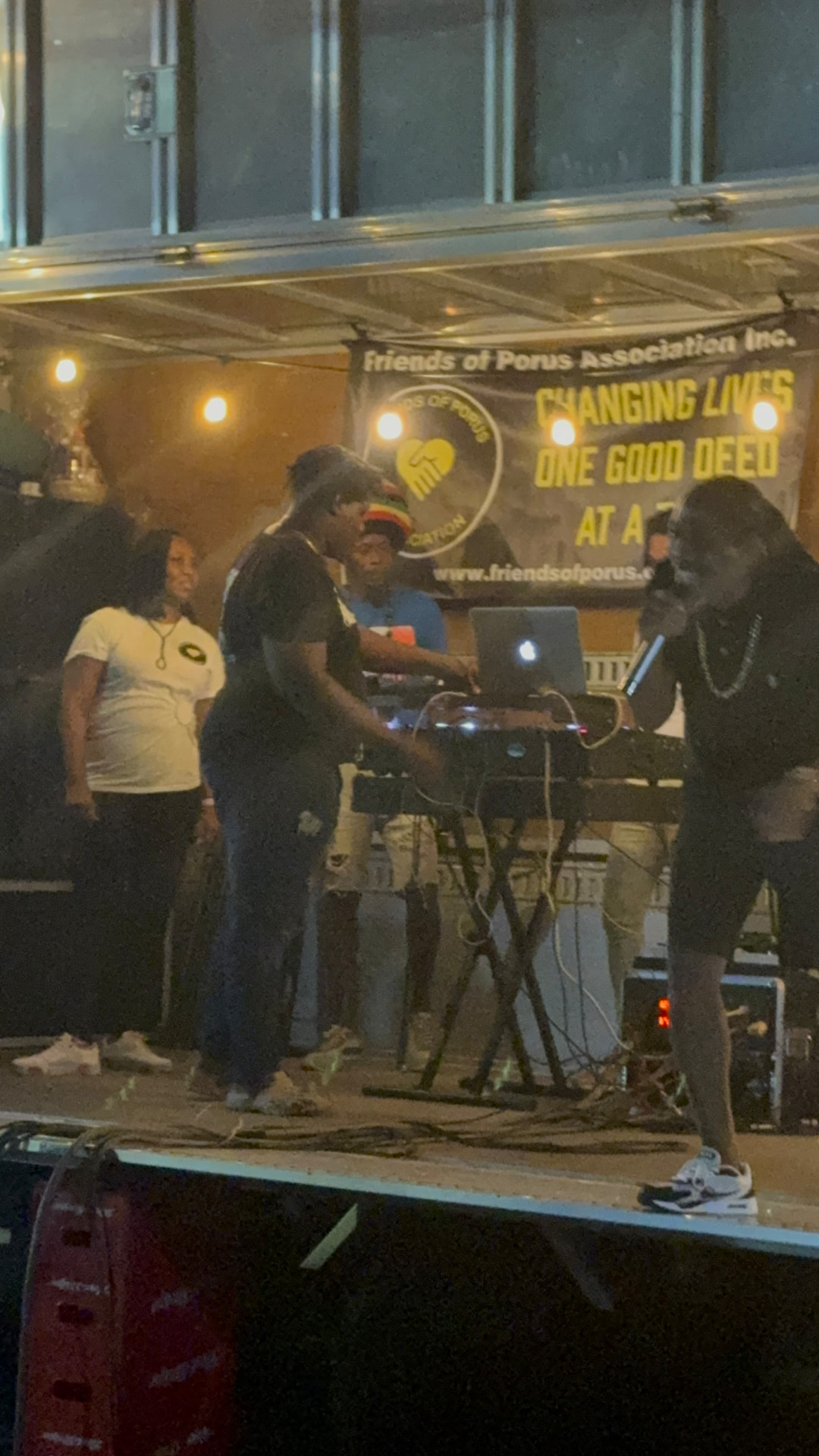 Community members enjoying music and games at the Porus street fair