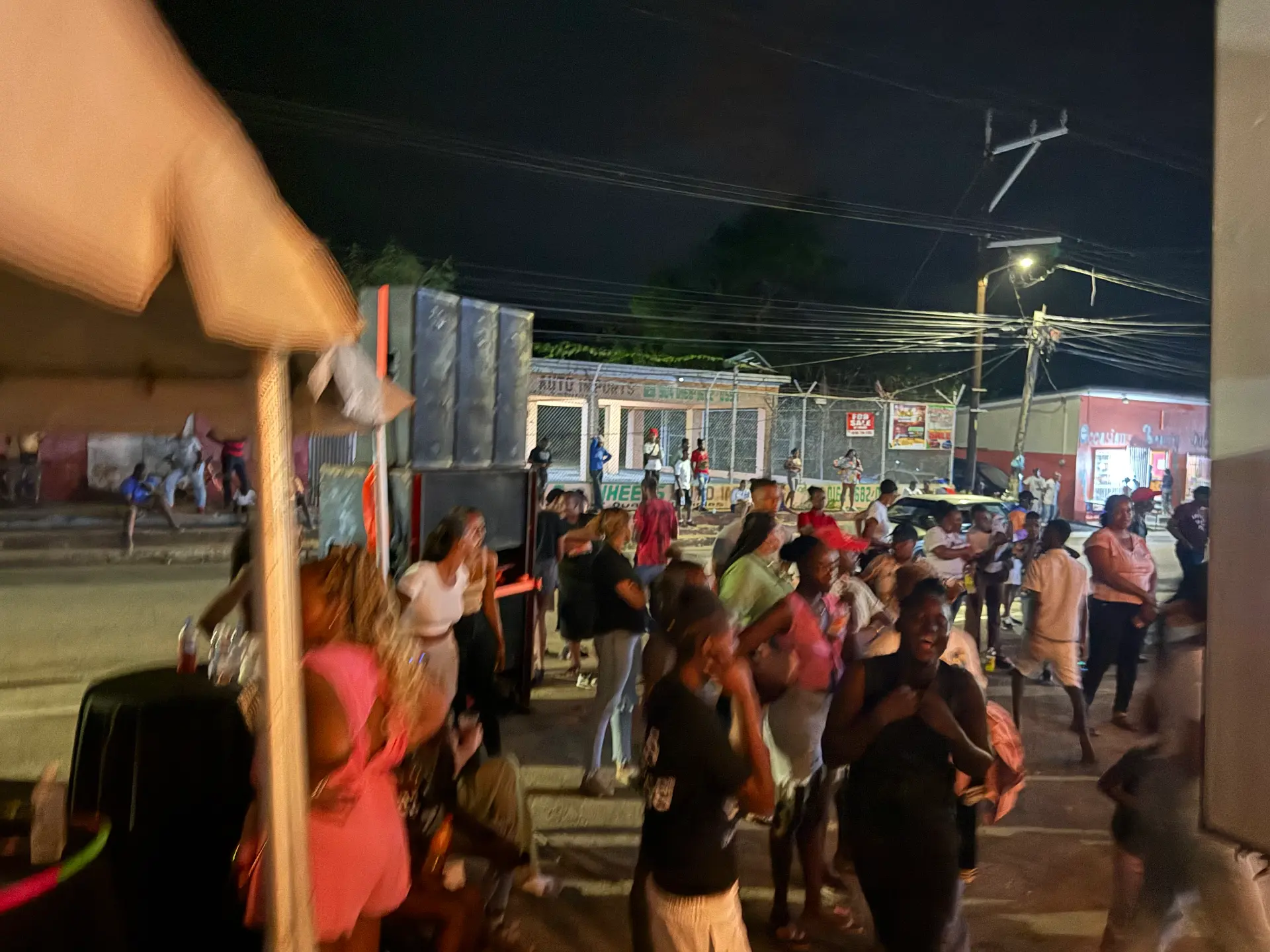 Vendor banners and booths along the Porus street fair